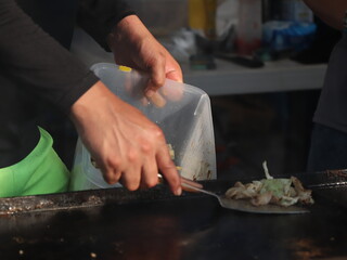 cooking hot BBQ in the street 