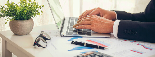 Banner Asian Business man hands using calculator counting tax financial bill. Tax audit Finacial...