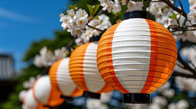 Colorful paper lanterns amid cherry blossoms in bright spring setting - Powered by Adobe