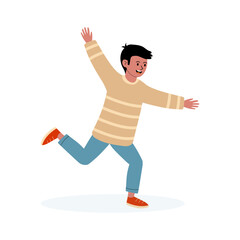 Youthful boy joyfully running in a casual outfit with bright shoes