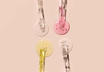 samples serum tests glass pipettes with drops of serum on a light beige background