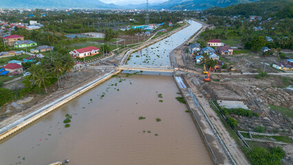 Aerial view of the river flowing through the village in Indonesia