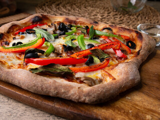Homemade Sourdough pizza on Wooden Table.