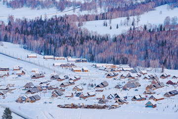 Hemu Village, Snowy Mountains, Forests, and Winter Snow Scenery in Xinjiang Uygur Autonomous Region, China On March 1st, 2023
