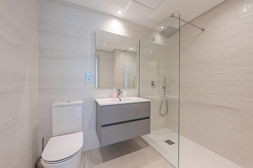 an image of a small guest bathroom with standing shower in mediterranean holiday home 