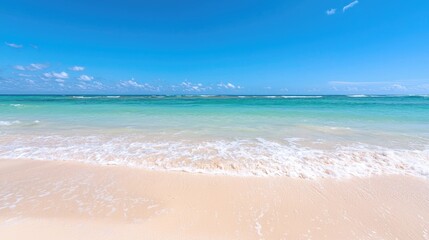 Wide shot of a tropical beach, calm azure water, white sand, and a clear sky. Ideal for use in travel advertising or relaxation themes