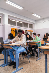 High school students studying and learning in classroom