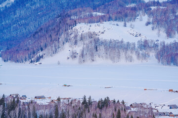 Hemu Village, Snowy Mountains, Forests, and Winter Snow Scenery in Xinjiang Uygur Autonomous Region, China On March 1st, 2023
