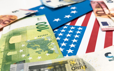 Fototapeta premium us and european union flags with euro and dollar banknotes 
