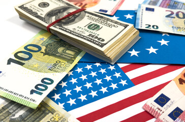 us and european union flags with euro and dollar banknotes 