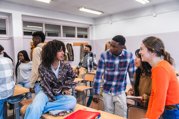 High school students collaborating on a project in classroom