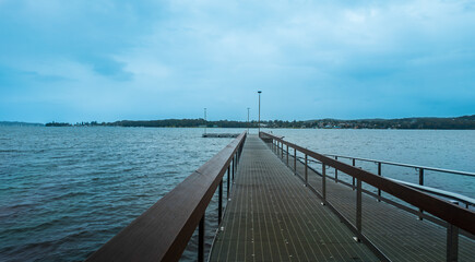 Obraz premium Sunset Avenue is a semi-circular seaside street that encircles Village Bay, offering beautiful scenic views along the way. it is located in Lake Macquarie.