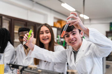 High school students doing chemical experiments in laboratory