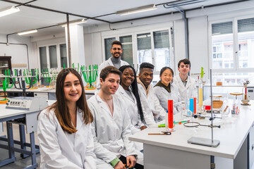 High school students smiling during chemistry lesson in laboratory