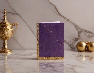 Elegant purple notebook with gold detailing on a marble surface, exuding sophistication and style.