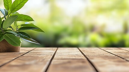 Green Plant in Brown Pot on Wooden Table with Blurred Green Background