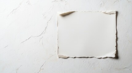 Blank vintage paper on textured surface, ideal for design or text space, with a minimalistic aesthetic.