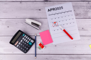 A calendar with April 15 highlighted in red, surrounded by a tax form 1099, calculator, and pencil,...