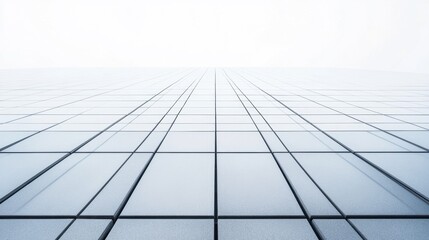 Modern flat roof covered with high-quality polymeric tiles, with sharp lines and a uniform pattern. Clean look with copy space.