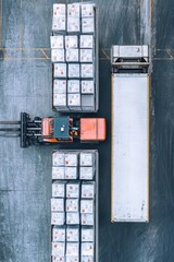 High Angle View of a Forklift Loading Goods in a Warehouse Environment