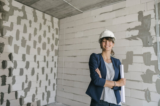 Portrait of female architect on construction site