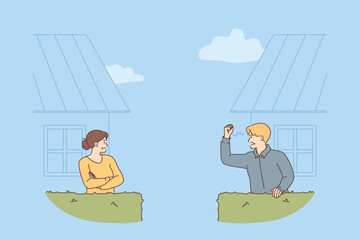Conflict two neighbors, between screaming man and offended woman standing in backyard of own houses