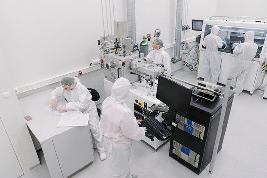 Team of scientists working in laboratory of technology center