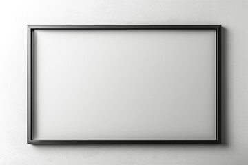 Elegant black-framed empty canvas on a minimalist white wall, perfect for displaying art.