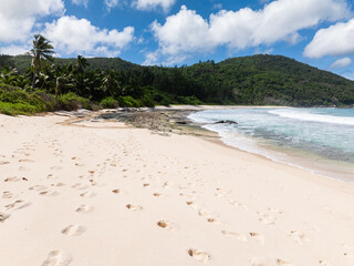 Tropical sandy beach and blue ocean in Seychelles. Police Bay beach.