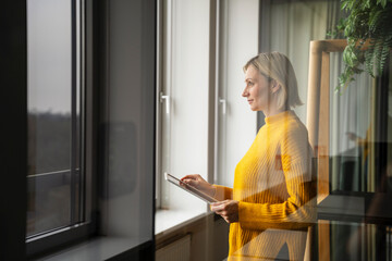 Businesswoman in a modern office using a tablet