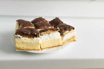 Pudding and whipped creame cake with a chocolate on the top