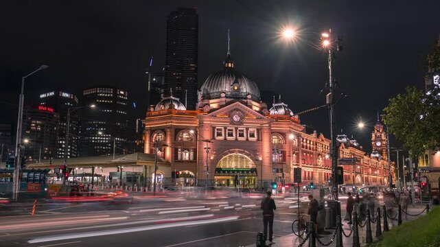 Flinders Street Train Station Time-Lapse at night with passing trams and cars