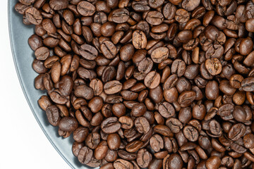 Roasted decaf coffee beans close up texture