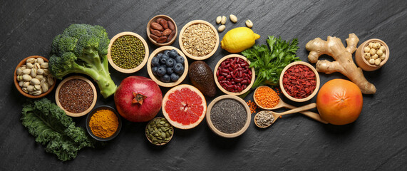 Superfood. Different healthy food products on grey table, flat lay