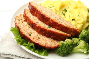 Delicious baked turkey meatloaf with mashed potato served on table, closeup