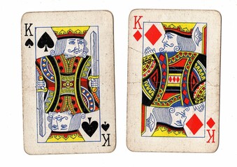 A blackjack or pontoon hand of vintage playing cards on a white background.
