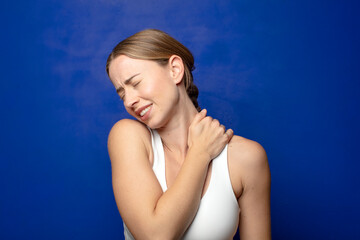 Obraz premium blonde woman feeling tired, stressed, anxious, frustrated and depressed, suffering with back or neck pain
