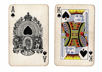 A blackjack or pontoon hand of vintage playing cards on a white background.