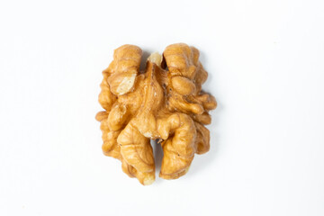 Macro peeled walnut, kernel, white isolate background, top view.