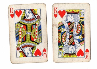 A blackjack or pontoon hand of vintage playing cards on a white background.