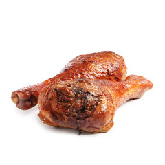 Delicious baked turkey drumsticks isolated on white