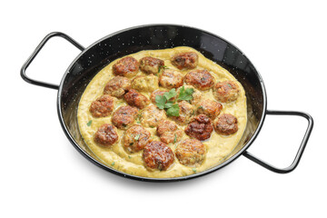 Delicious meatballs with gravy cream sauce and herbs isolated on white