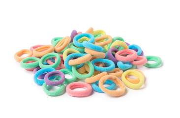 Many colorful hair ties isolated on white