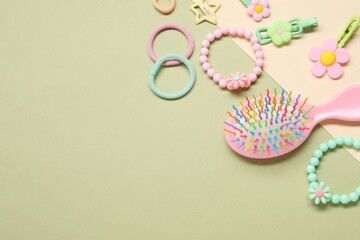 Cute hair accessories on color background, flat lay. Space for text