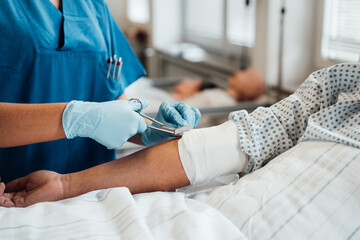 Doctor treating a patient's arm injury in a clinic