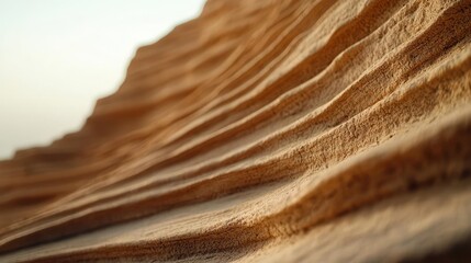 Obraz premium Weathering process idea. Close-up of textured sand dunes showcasing natural patterns and flowing forms.