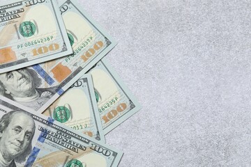 Money, hundred dollar background pattern on gray background. Money is scattered on the table....