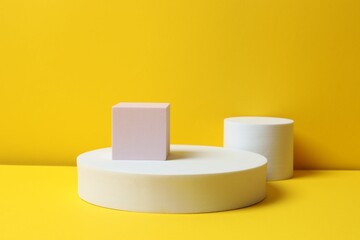 Podiums on a yellow background