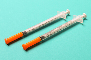Top view of insulin syringes ready for injection on colorful background. Diabetic concept with copy...