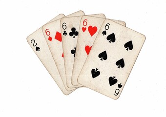 A poker hand of grubby old playing cards on a white background,.
